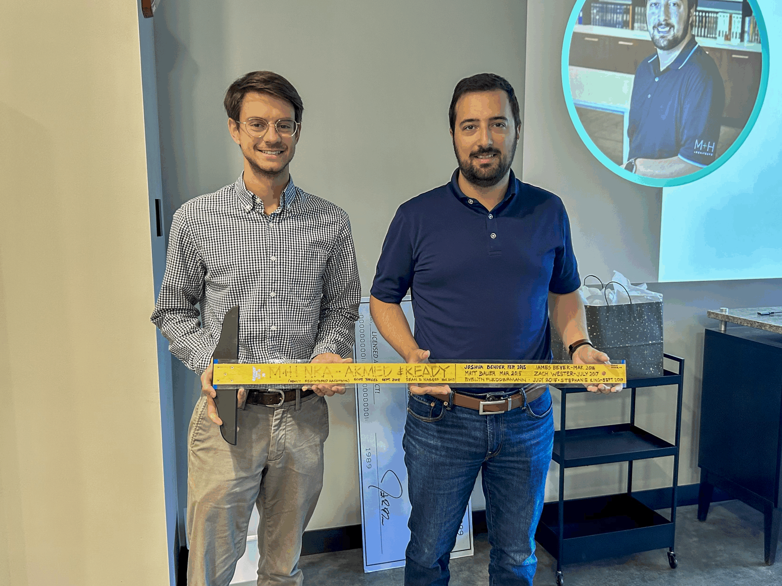 Matt Isaak passing the T-Square to Blake Anderson for becoming a Registered Architect.